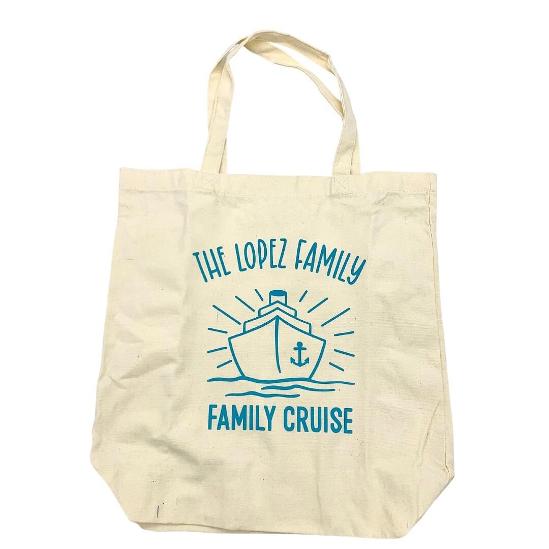 A Tote Bag displaying a ship with the words The Lopez Family, Family Cruise.